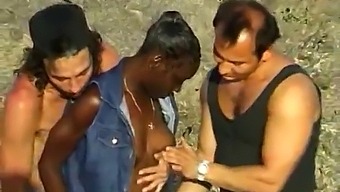 Two White Guys Pleasure A Black Woman At The Seaside In A Threesome