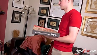 A Mature Redhead Indulges In A Pizza-Themed Sexual Transaction