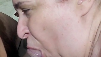 A Mature Woman With An Ample Figure Gives Oral Pleasure To A Young Delivery Man